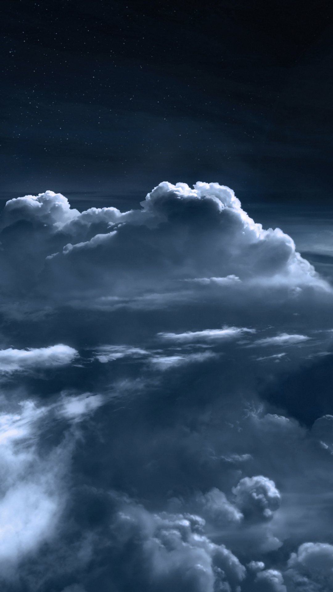 Sci-fi space phone wallpaper: vertical view of luminescent layered clouds under a deep-blue, star-speckled sky, evoking an ethereal cosmic atmosphere.
