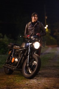 Echo TV Show wallpaper featuring Alaqua Cox posing with a motorcycle at night.