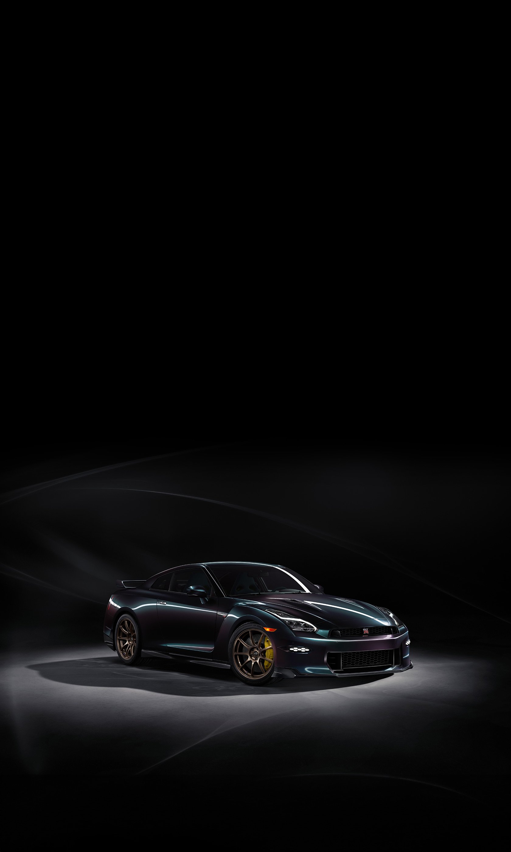 Nissan GT-R T-spec car displayed as a sleek phone wallpaper with a dark background.