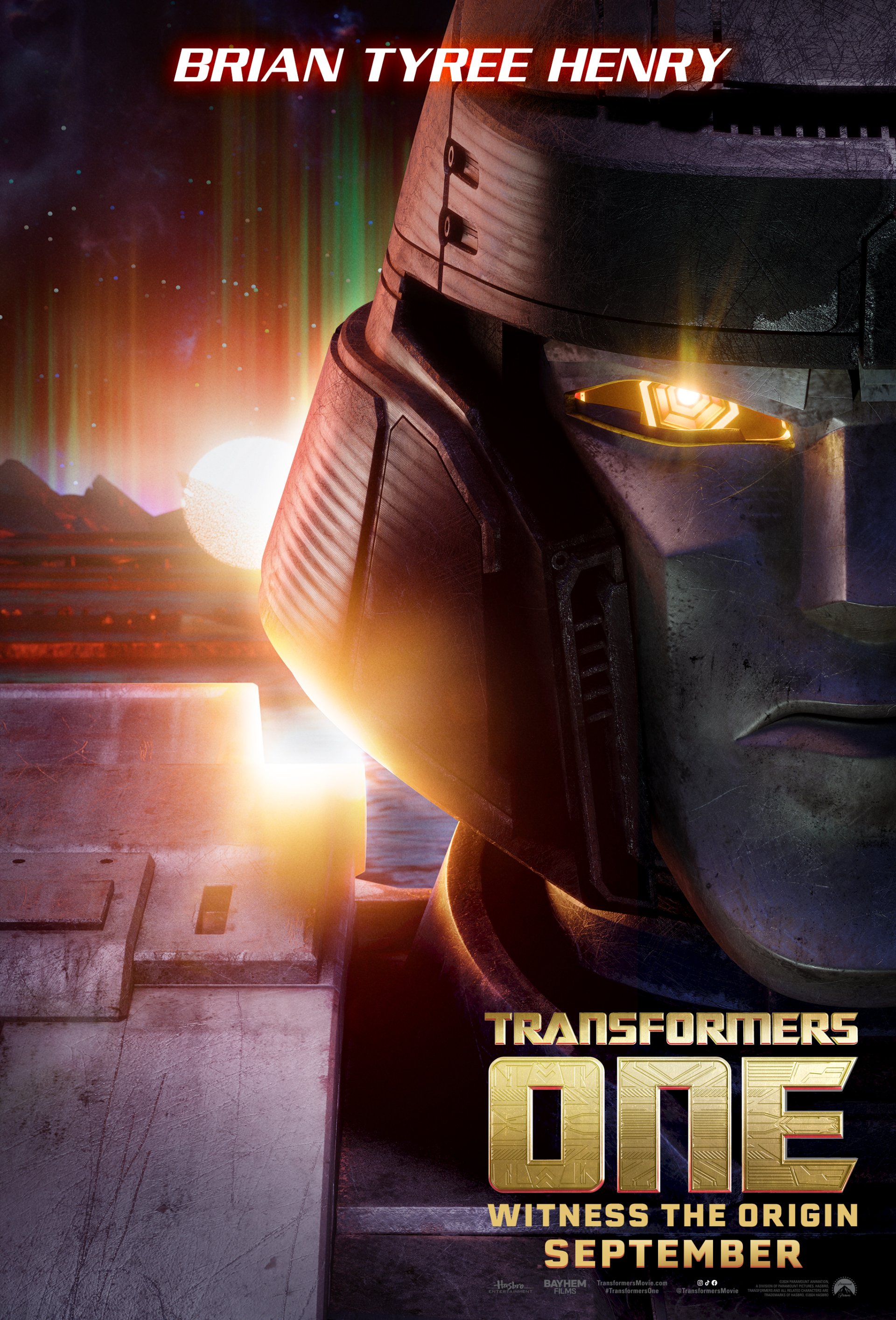 Phone wallpaper featuring a promotional image for the movie Transformers One, with a closeup of a Transformers' face and the text Brian Tyree Henry and Witness The Origin September.
