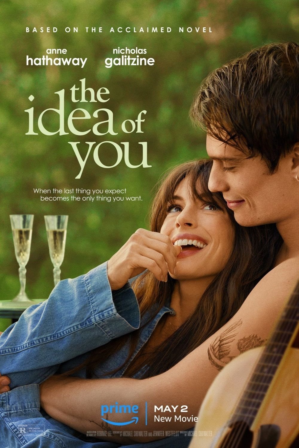 Phone wallpaper of The Idea of You movie poster featuring Anne Hathaway and Nicholas Galitzine, where a smiling woman leans on a man holding a guitar.