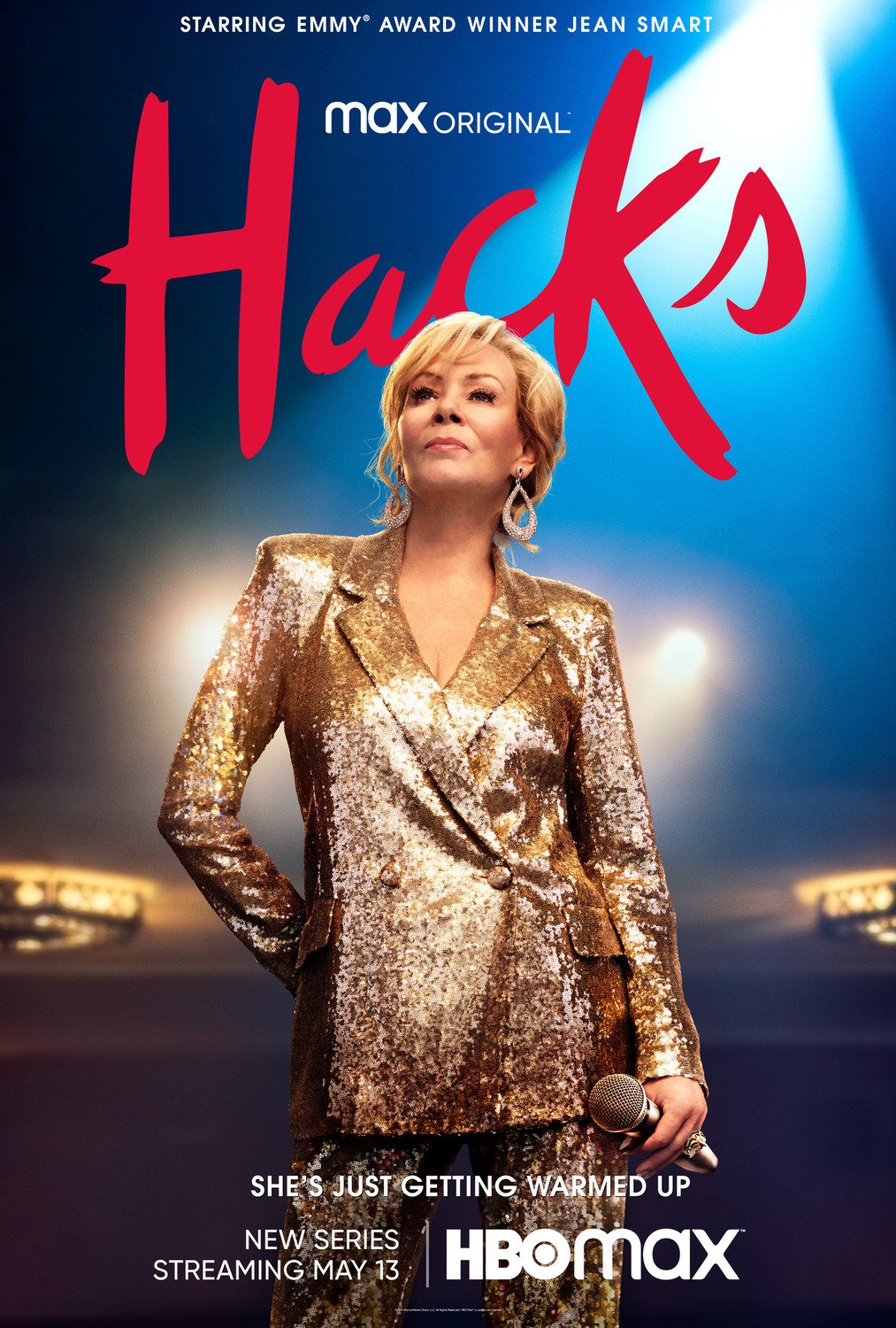 Phone wallpaper featuring a promotional poster for the TV show Hacks (2021), with Jean Smart in a golden blazer, against a dusk-lit backdrop.
