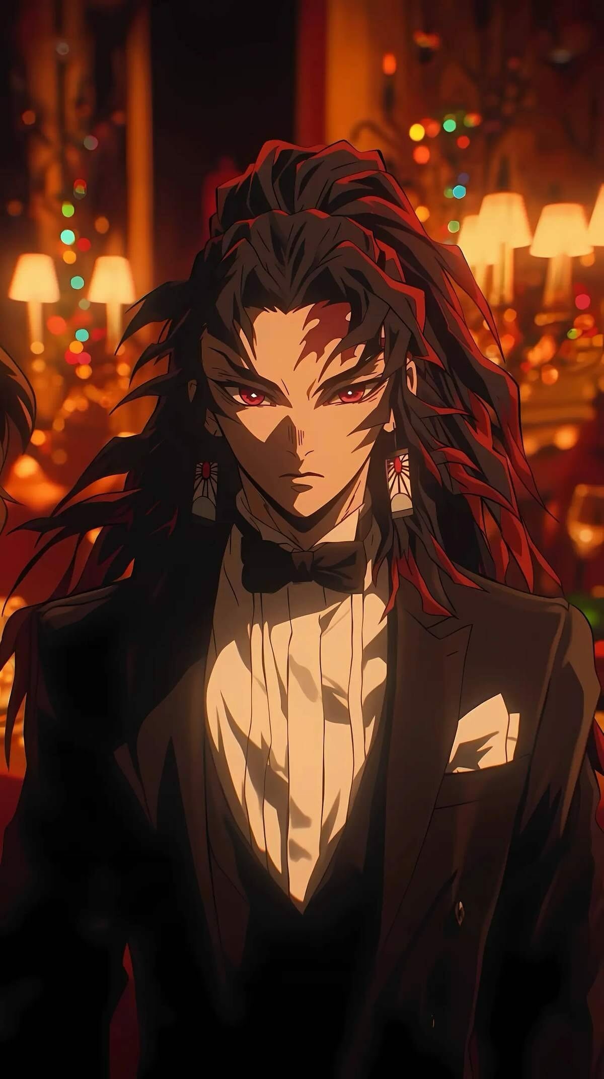 Anime phone wallpaper featuring Yoriichi Tsugikuni from Demonslayer comics, dressed in a sharp black tuxedo against a warm, glowing background.