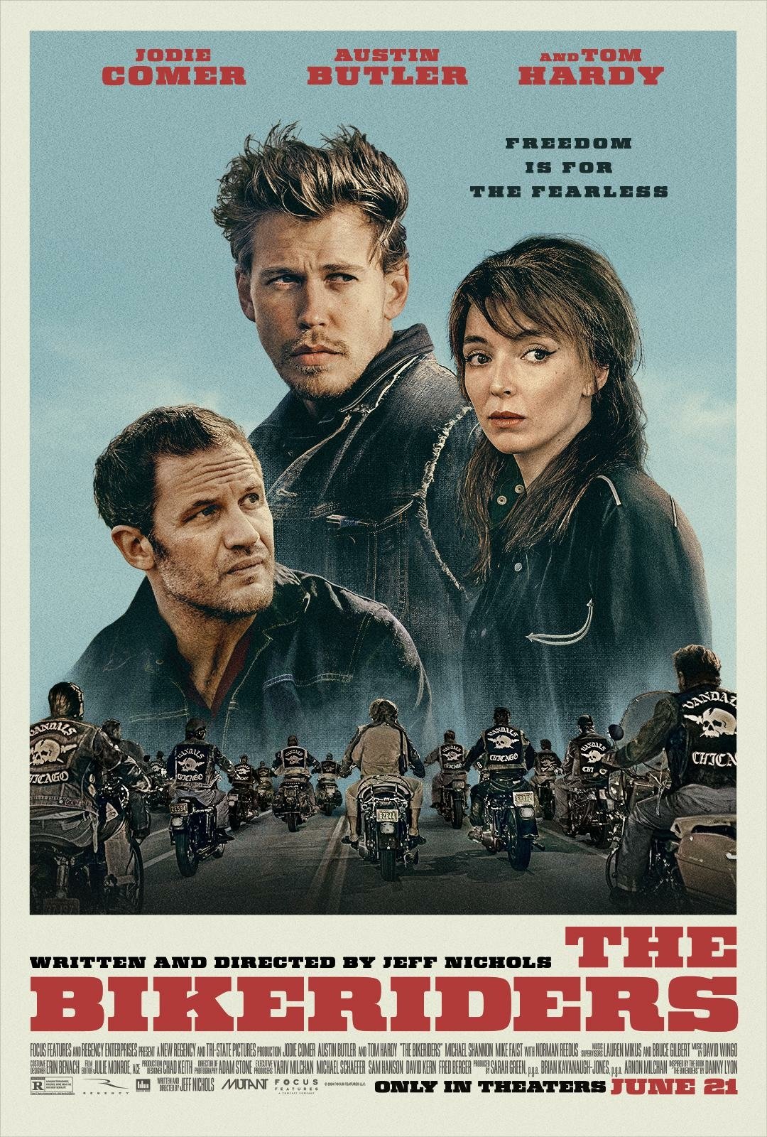 Phone wallpaper featuring a poster for the movie The Bikeriders, showcasing three central characters against a background of a motorcycle gang, with the tagline Freedom is for the fearless.