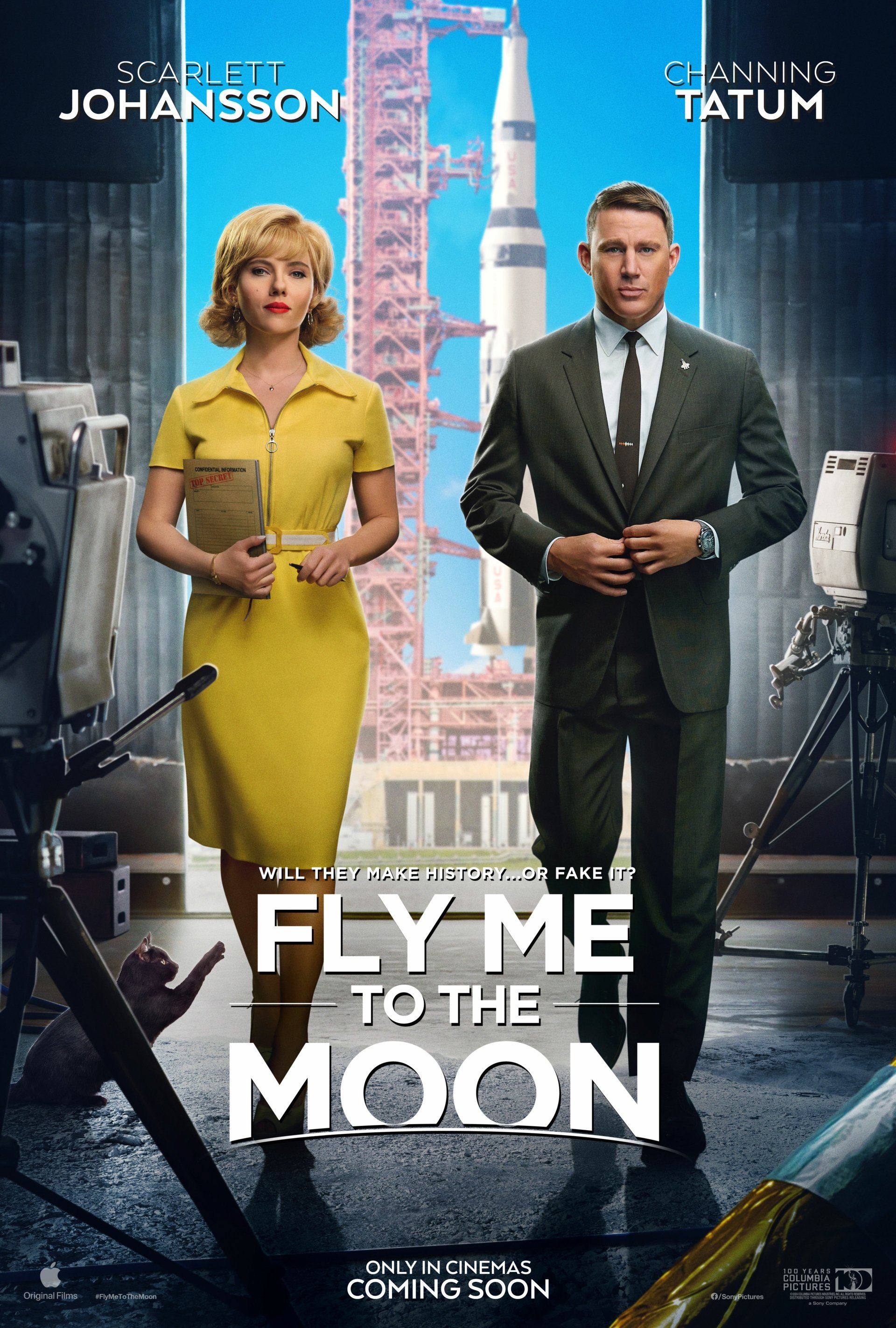 Phone wallpaper featuring Scarlett Johansson and Channing Tatum in the movie Fly Me to the Moon (2024), with a backdrop of a space rocket and an array of vintage tech equipment.