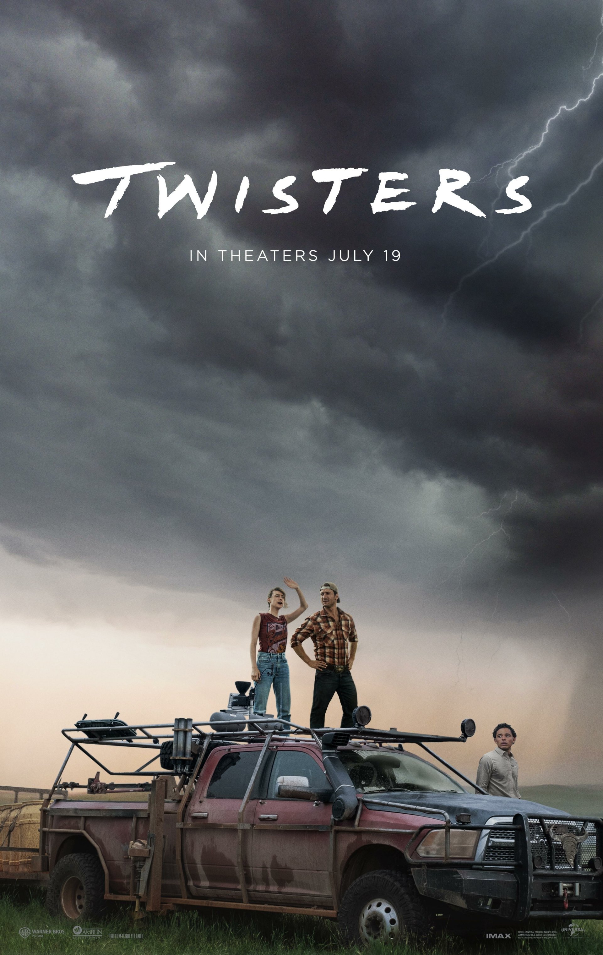 Phone wallpaper featuring the movie Twisters showing storm chasers on a vehicle under a dramatic storm-filled sky. Text on the image reads, Twisters - In Theaters July 19.