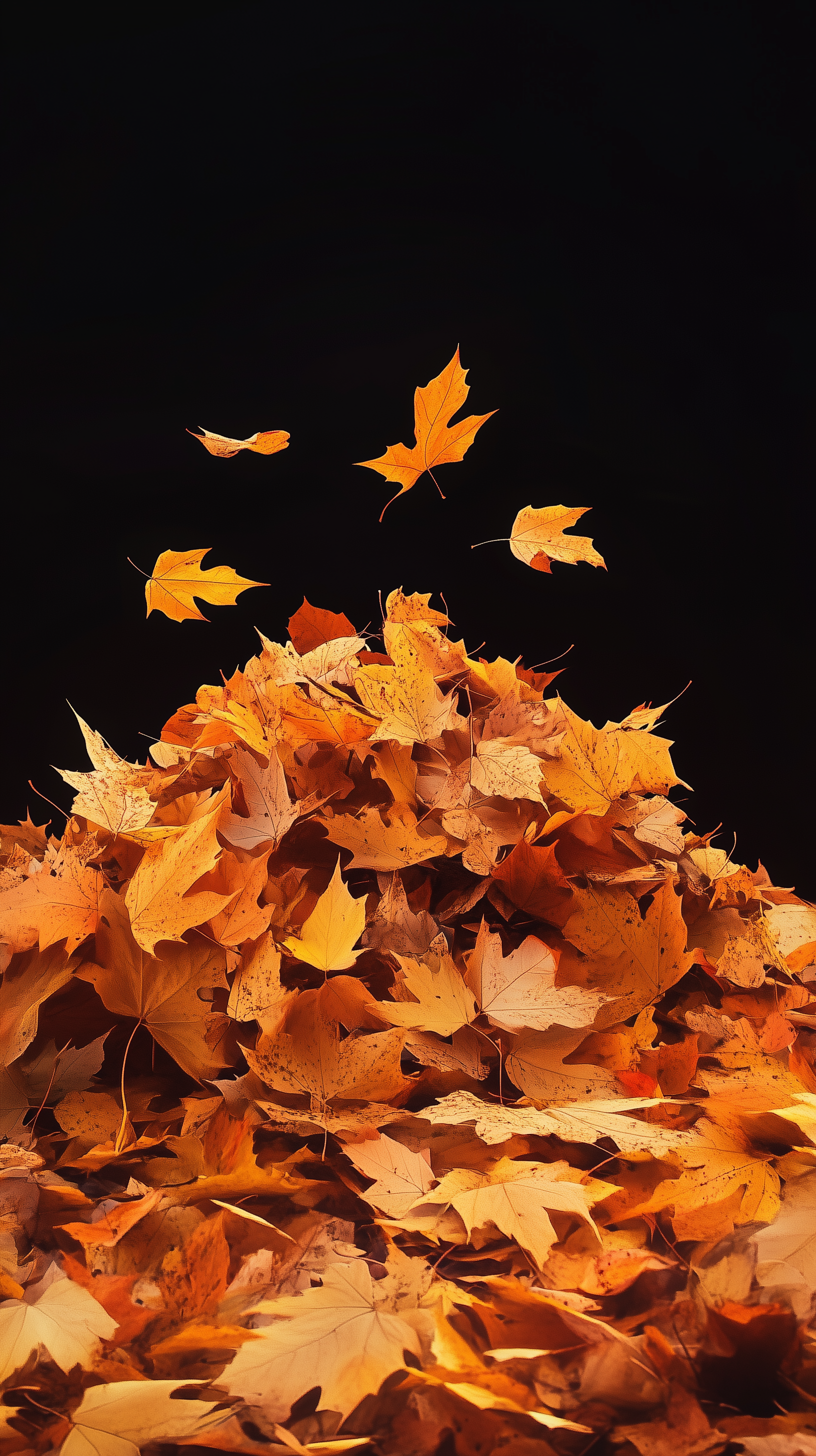 A vibrant leaf pile in autumn hues, this phone wallpaper captures the essence of fall, bringing a warm and natural touch to your device.