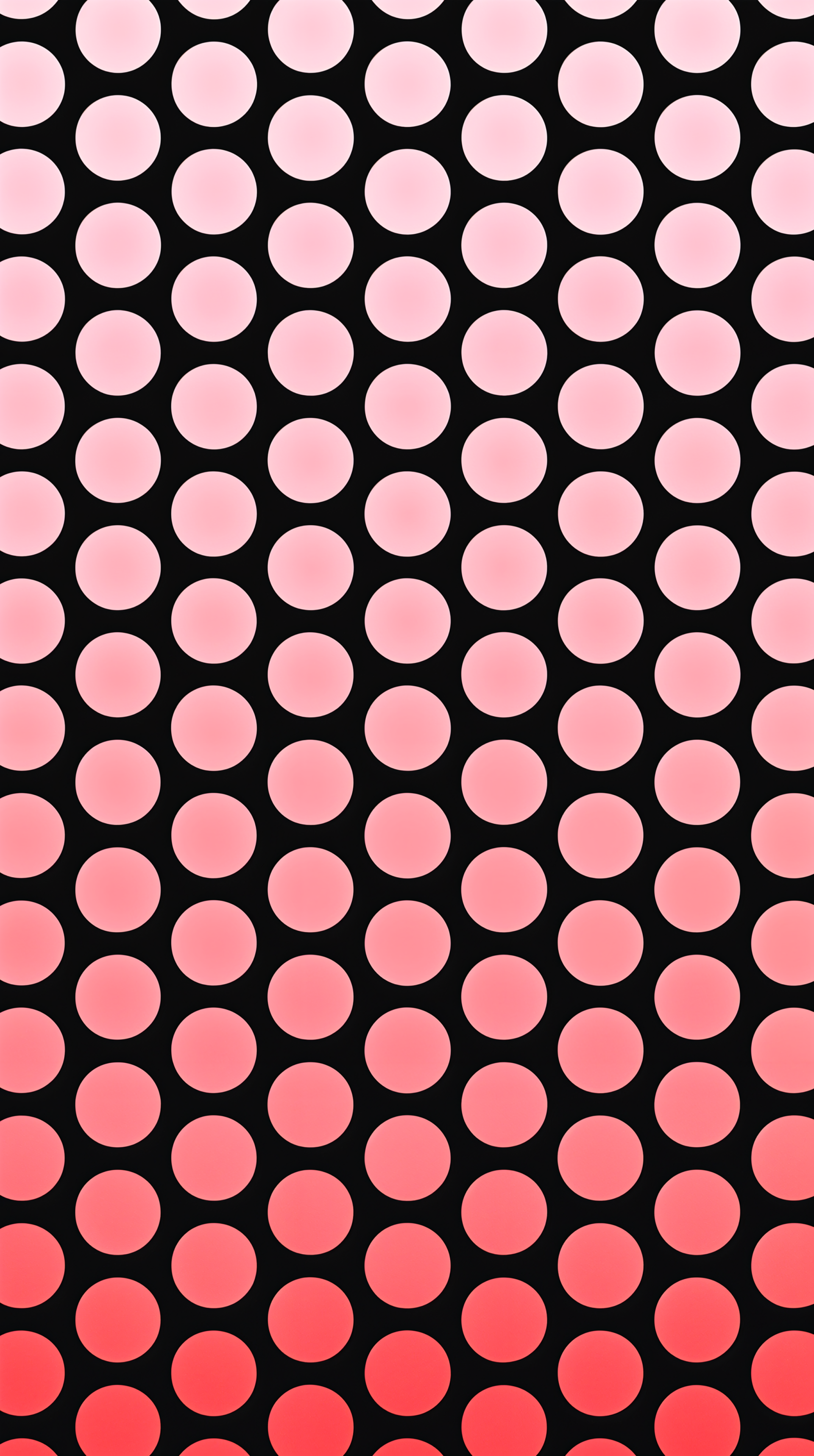 A vibrant phone wallpaper featuring a gradient of polka dots, transitioning from light pink to deep red against a black background, adding a lively touch to any device.