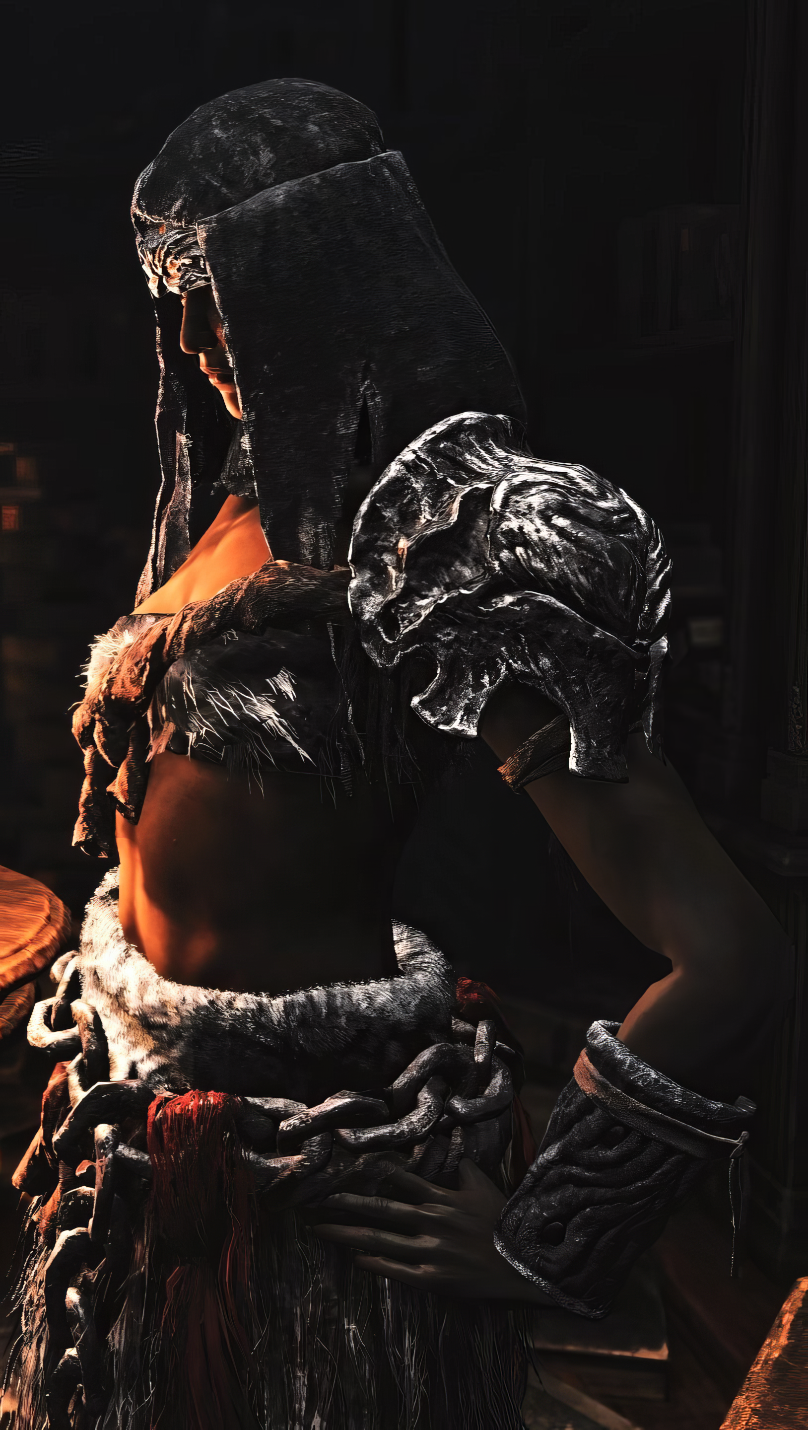 A dark and striking phone wallpaper from the video game Elden Ring, featuring a character in intricate armor with a mysterious and powerful presence.