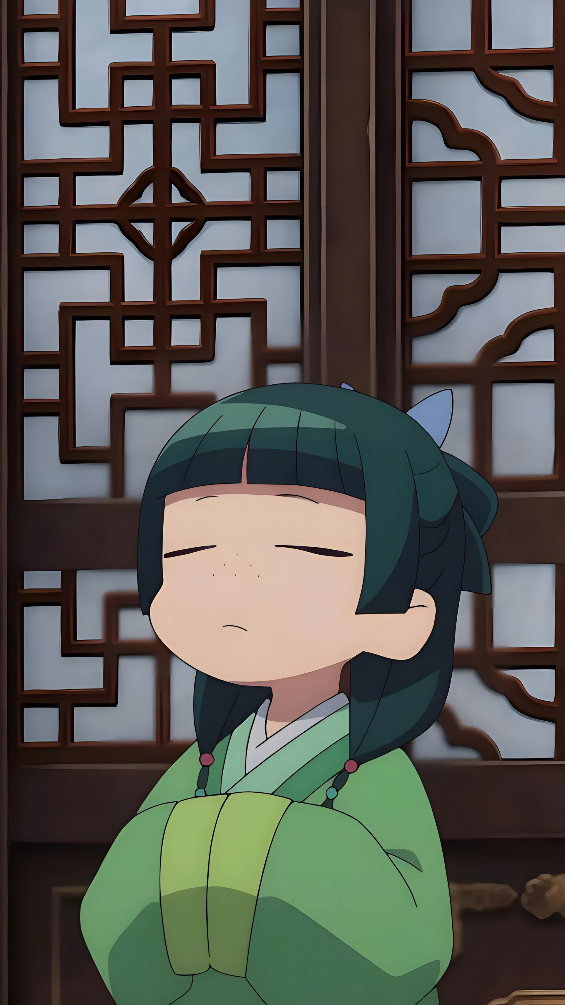 Phone wallpaper featuring Maomao from the anime The Apothecary Diaries, set against a traditional wooden lattice background, designed for iPhone and Android screens.