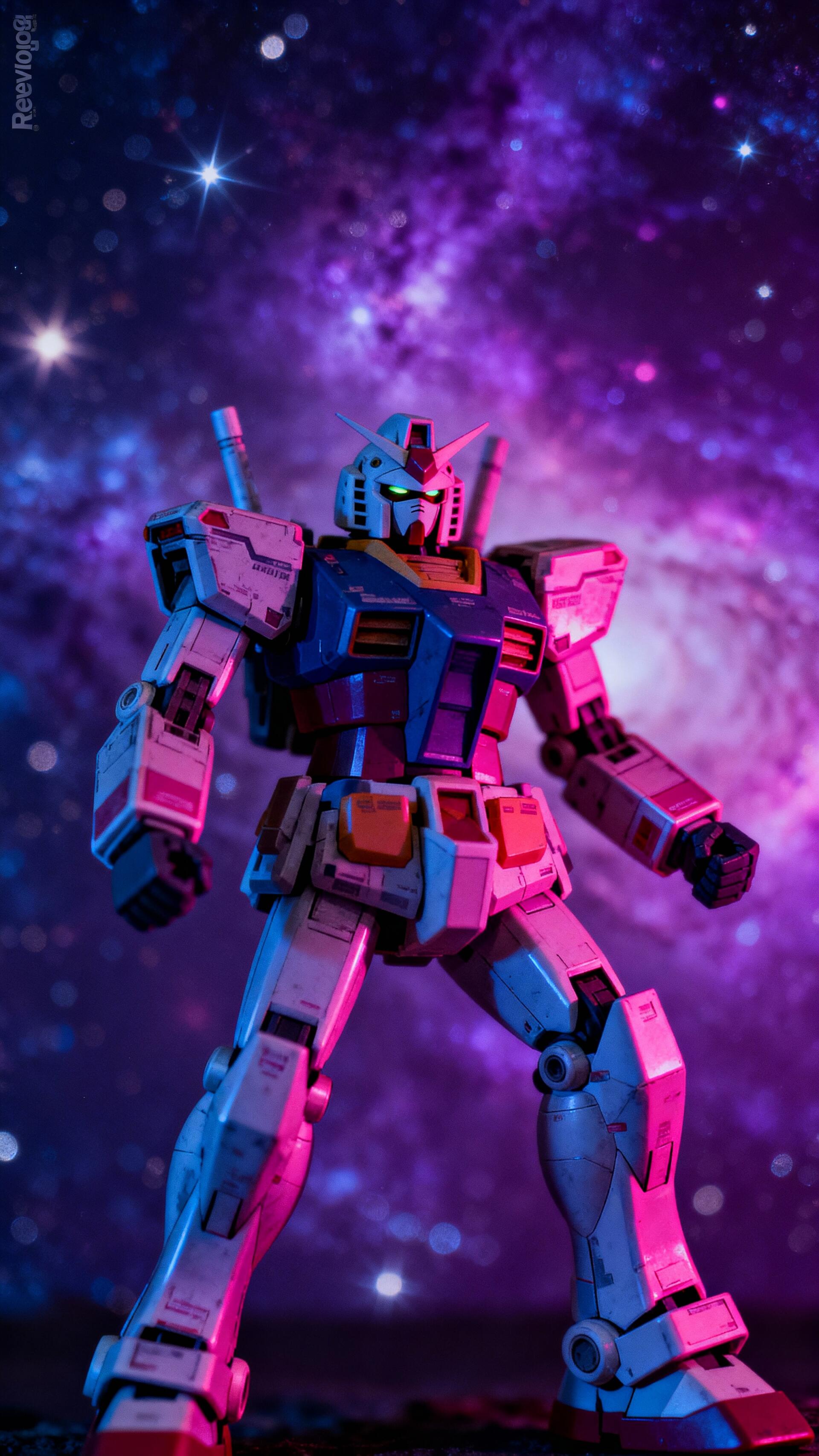 Gundam mecha posed against a purple starfield with neon pink and blue lighting — vertical phone wallpaper for iPhone and Android.