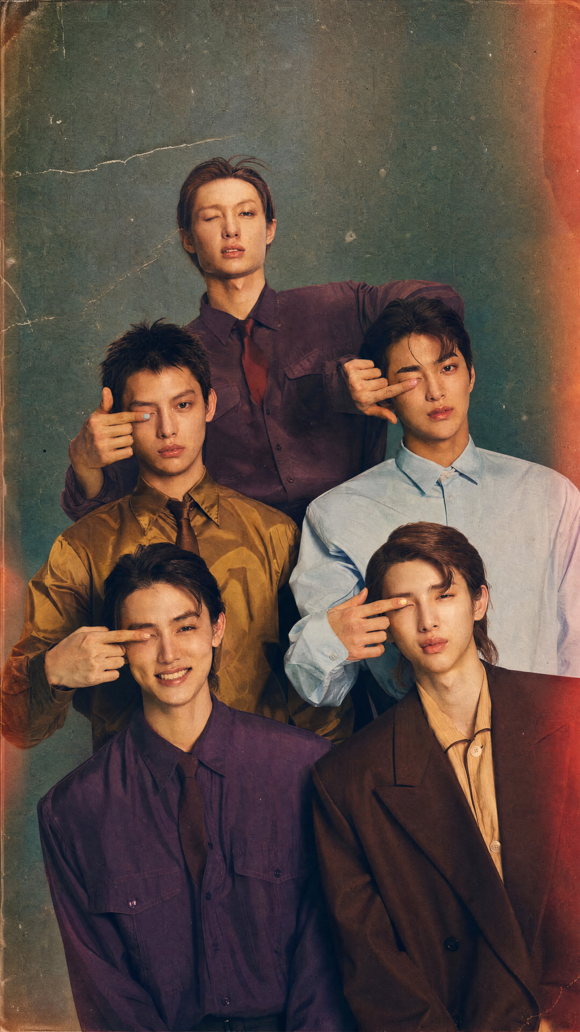 Cortis iPhone wallpaper: vintage-style portrait of five young men in coordinated shirts, each framing one eye with fingers; warm tones, film grain and light leaks.
