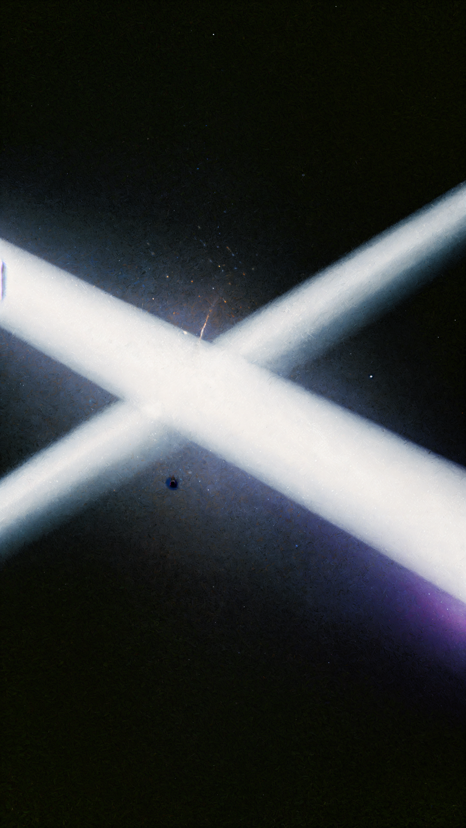 iPhone wallpaper of two bright white beams of light crossing in an X against a deep black background.