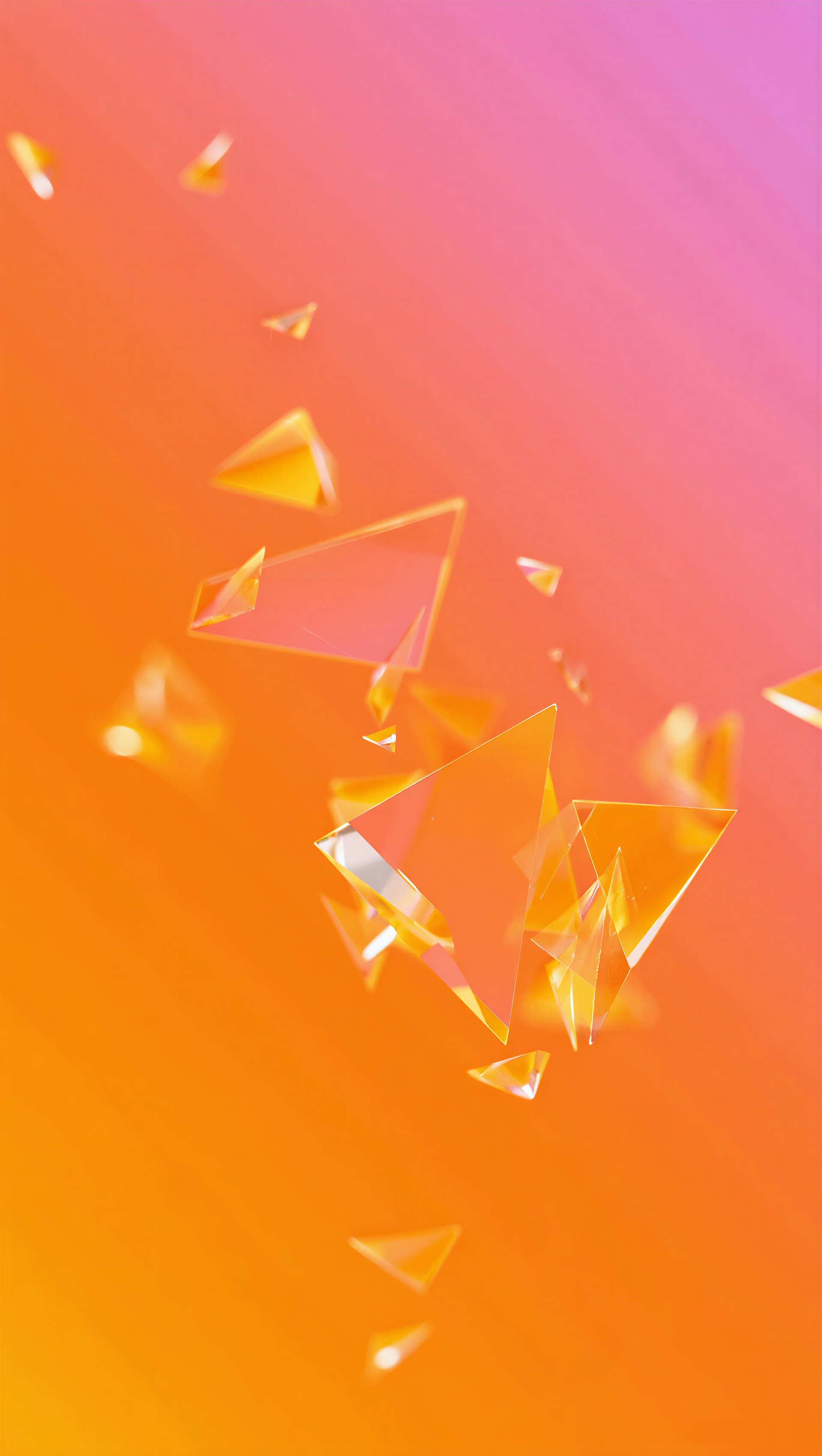 iPhone wallpaper featuring glassmorphism: translucent triangular glass shards floating over a warm orange-to-pink gradient.