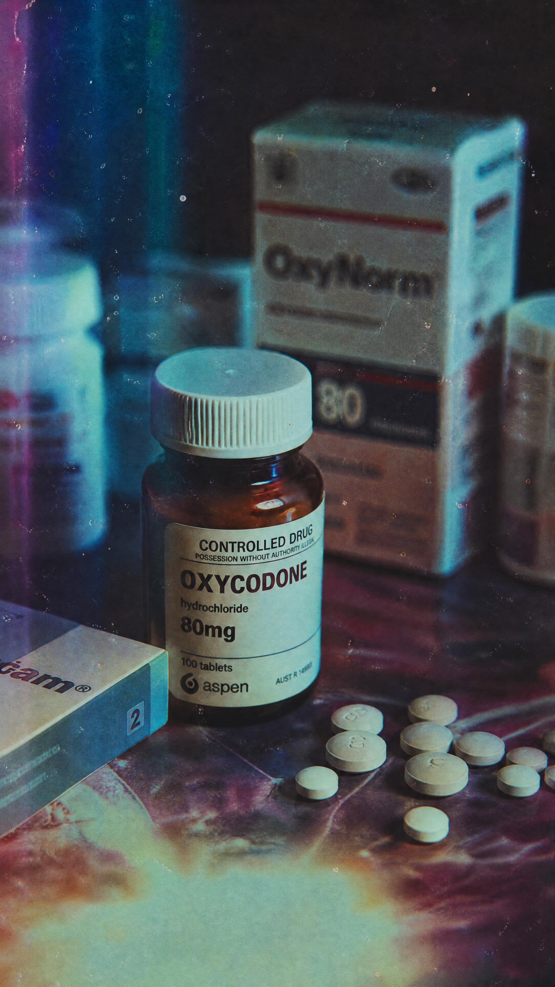 Phone wallpaper of a medicine scene: prescription oxycodone bottle (80 mg), pill box and scattered white tablets on a moody, neon-lit surface.