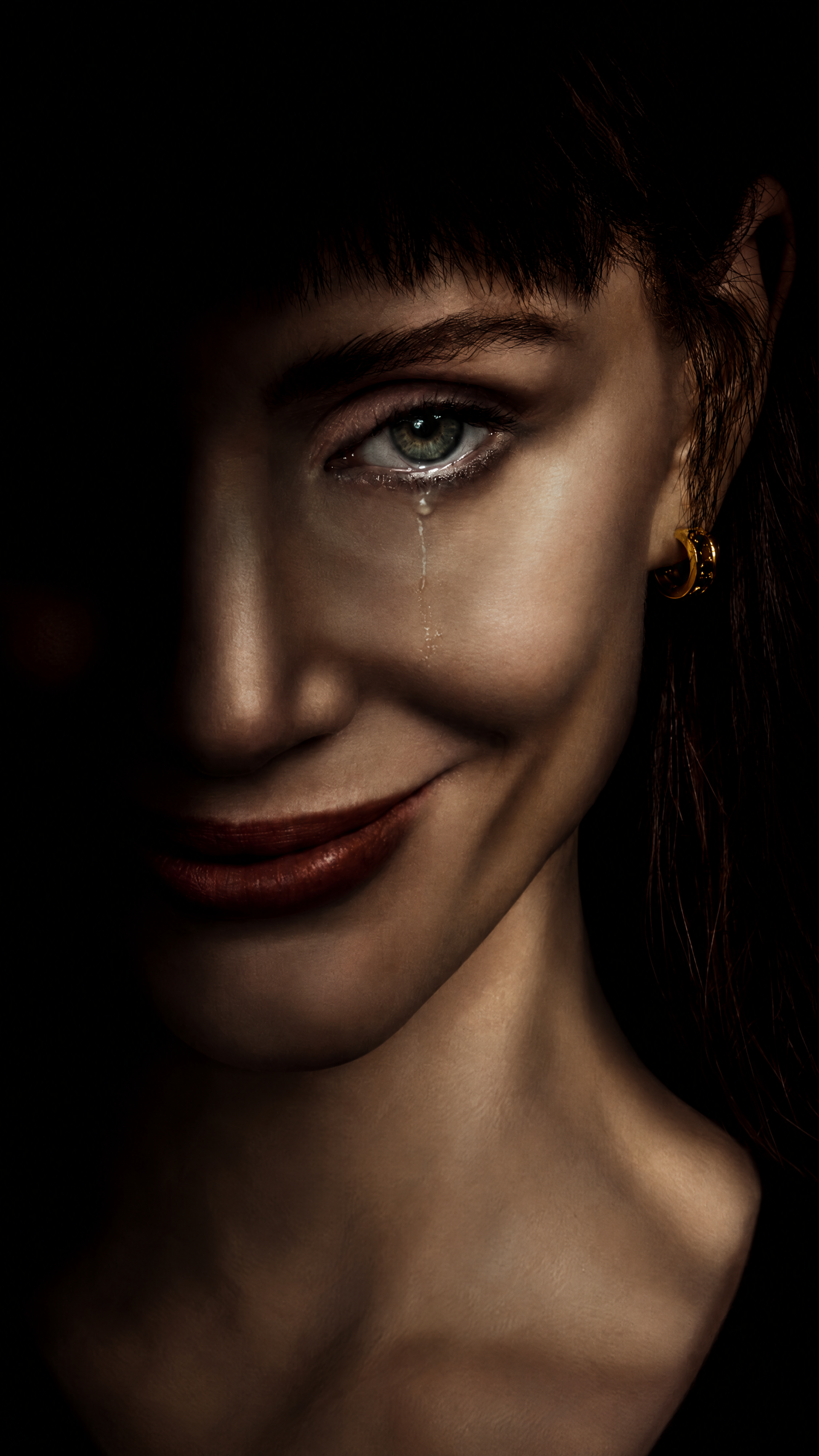 Jessica Chastain in a tearful, shadow-lit portrait from Other Mommy, formatted as a vertical iPhone wallpaper.