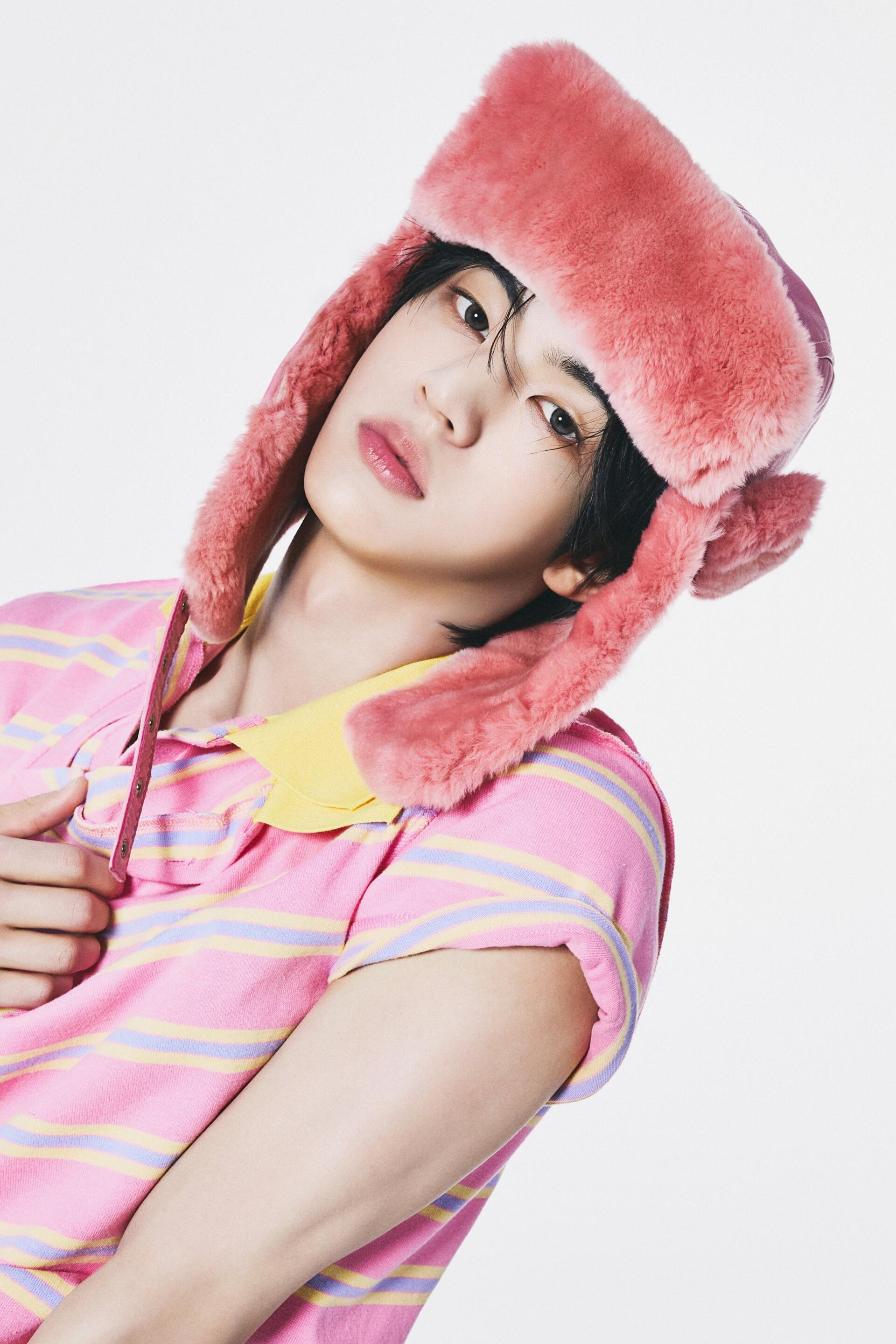 TWS Dohoon in a pink furry hat and glasses, wearing a pastel striped shirt for a TO US iPhone wallpaper.