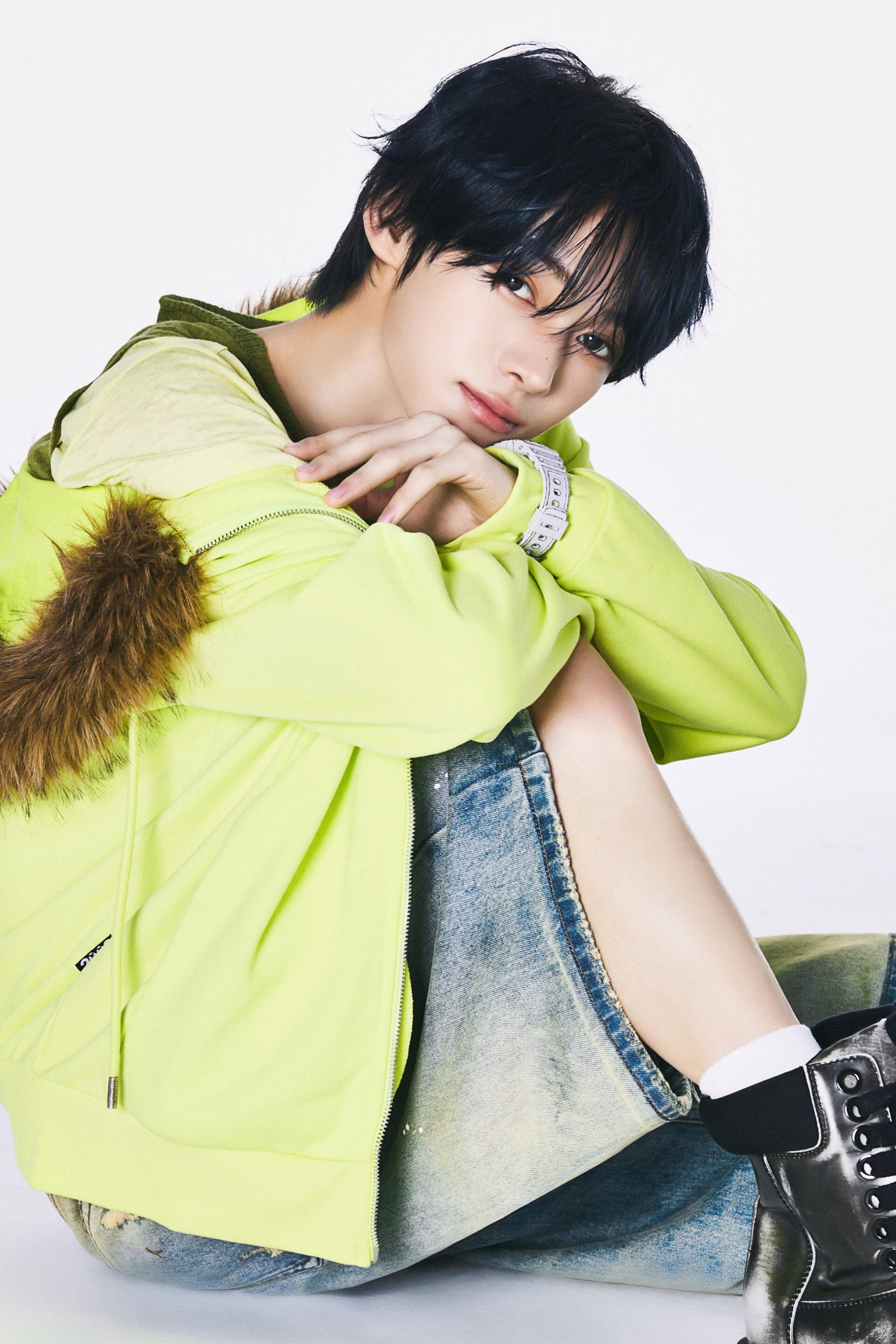 TWS Hanjin portrait in a lime green jacket, posing against a clean white background as a stylish iPhone wallpaper.