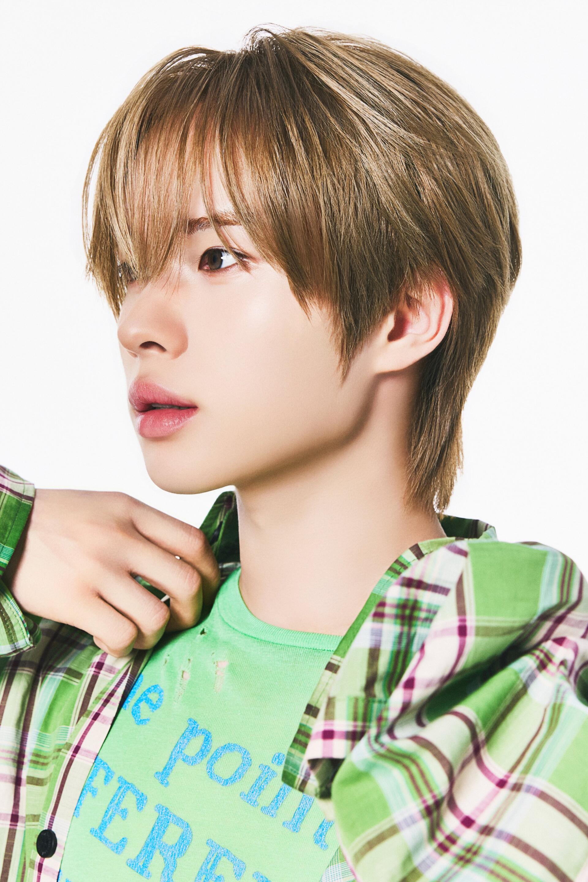 TWS Kyungmin portrait phone wallpaper, featuring the K-pop idol in a green plaid shirt against a clean white background.