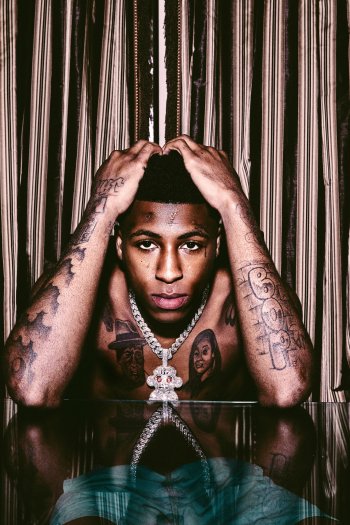 Phone wallpaper featuring a stylized portrait of a tattooed individual with a reflective pose, associated with music and YoungBoy Never Broke Again.