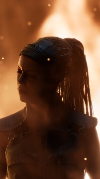 Senua's Saga: Hellblade II video game character silhouette as mobile wallpaper with fiery background.