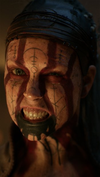 Close-up of Senua from Senua's Saga: Hellblade II, showcasing intense expression and striking facial markings, designed as a dynamic phone wallpaper for fans of the video game.