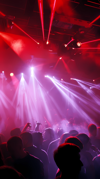 A vibrant nightclub scene featuring dancers immersed in colorful light beams and fog, capturing the energy of a lively party atmosphere. This image serves as an engaging phone wallpaper.