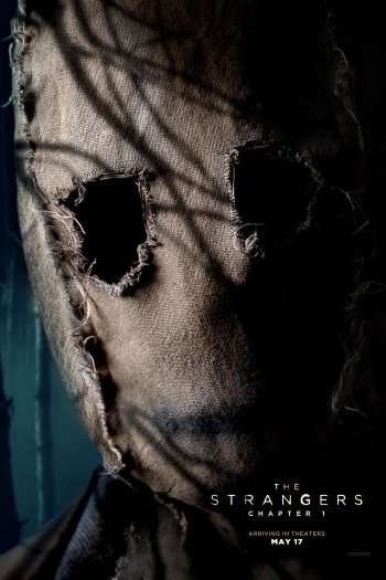 Phone wallpaper featuring a haunting image from the movie The Strangers: Chapter 1 depicting a masked figure with tattered eye holes.