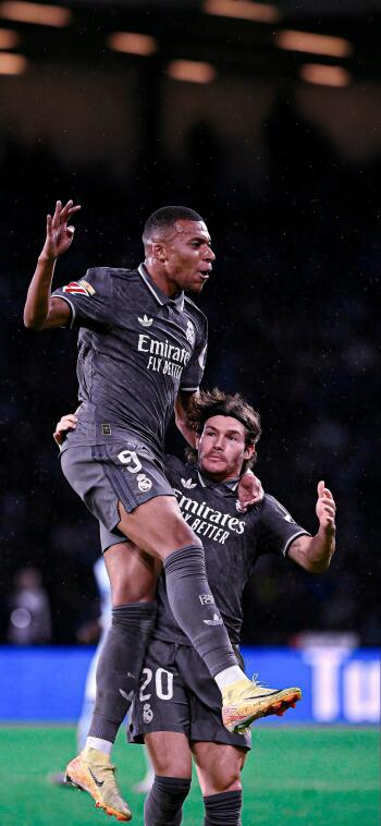 Kylian Mbappé celebrates a goal with teammates in a thrilling moment for Real Madrid C.F., showcasing the excitement and passion of soccer.