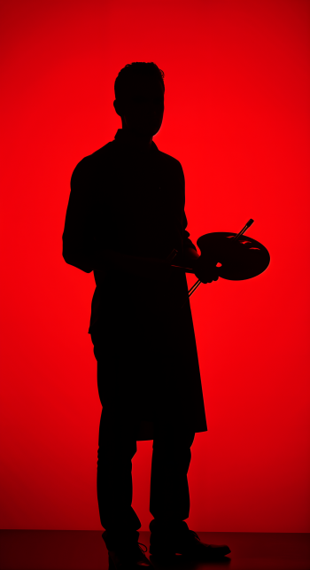 Silhouette of an artist holding a palette against a striking red background, creating a bold and dynamic phone wallpaper.