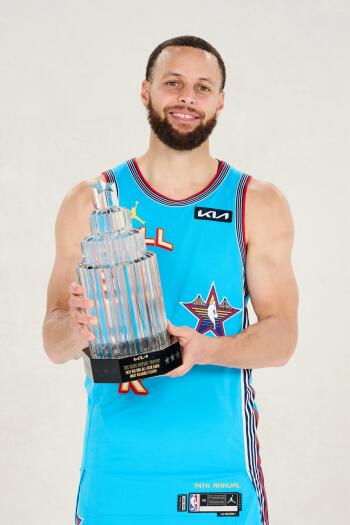 Stephen Curry in an NBA All-Star Game jersey smiles while holding a trophy, showcasing his achievement in basketball. A vibrant phone wallpaper celebrating his legacy.