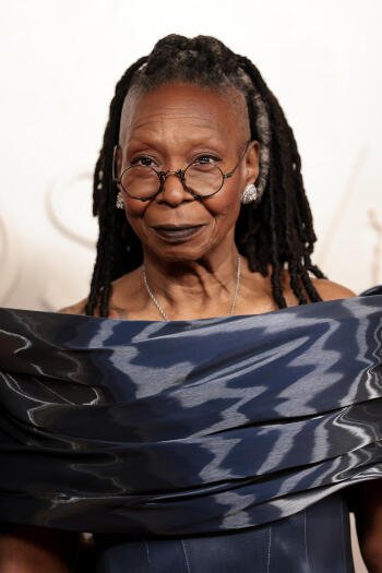 A stylish Whoopi Goldberg poses in elegant attire at the Academy Awards, exuding confidence and grace, suitable for a phone wallpaper to celebrate cinematic excellence.