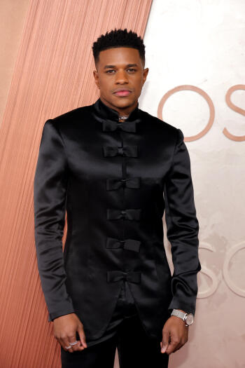 Phone wallpaper featuring Jeremy Pope dressed in a sleek black outfit at the Academy Awards (Oscars), designed for both iPhone and Android displays.