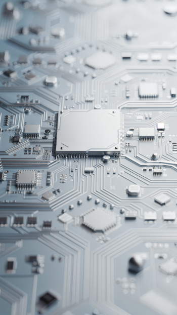 Vertical iPhone wallpaper showing a close-up silver circuit board pattern with a central microchip and intricate conductive traces.