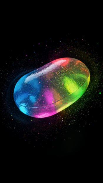 Vertical iPhone wallpaper: glowing neon jelly bean floating amid cosmic sparkles on a black background with blue, pink and green gradient hues.