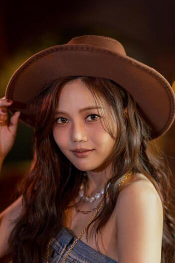 Hyojung of Oh My Girl in a cowboy hat, close-up portrait phone wallpaper.