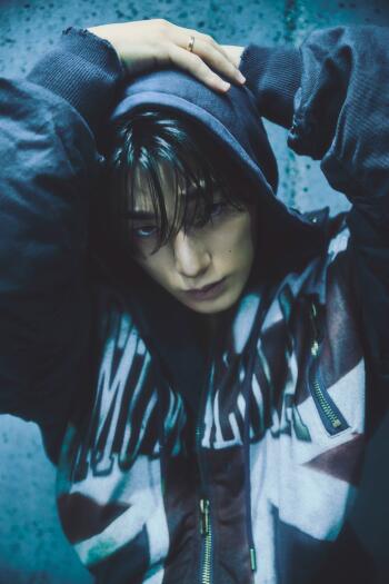 ATEEZ San in a blue hoodie for the Golden Hour era, styled as a moody iPhone wallpaper.