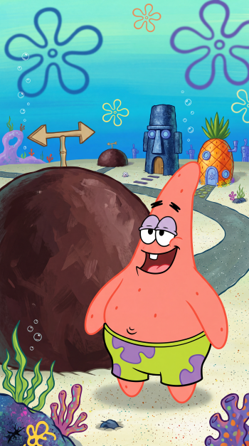 Patrick Star smiling beside a large rock in the underwater world of SpongeBob SquarePants, iPhone wallpaper.