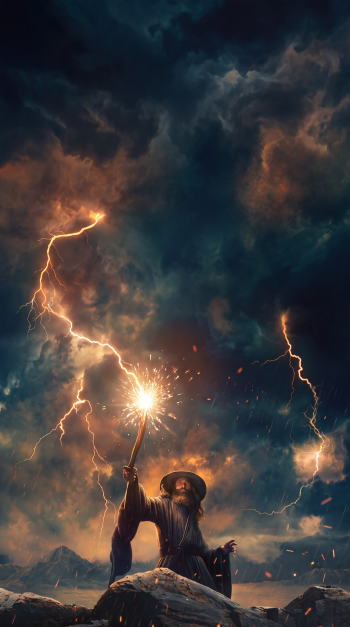 Gandalf summons lightning beneath a stormy sky in The Lord of the Rings: The Rings of Power, cinematic warrior phone wallpaper.