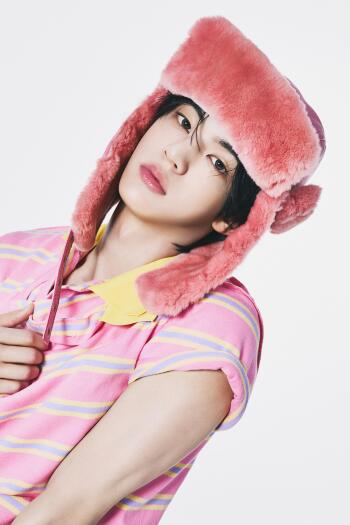 TWS Dohoon in a pink furry hat and glasses, wearing a pastel striped shirt for a TO US iPhone wallpaper.