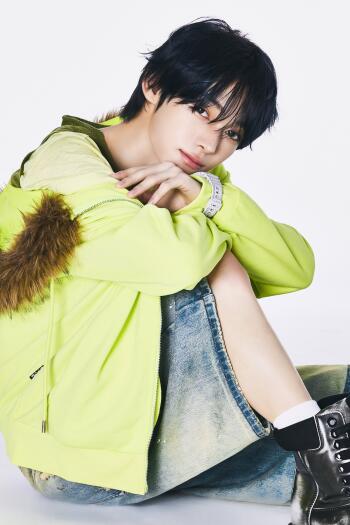 TWS Hanjin portrait in a lime green jacket, posing against a clean white background as a stylish iPhone wallpaper.