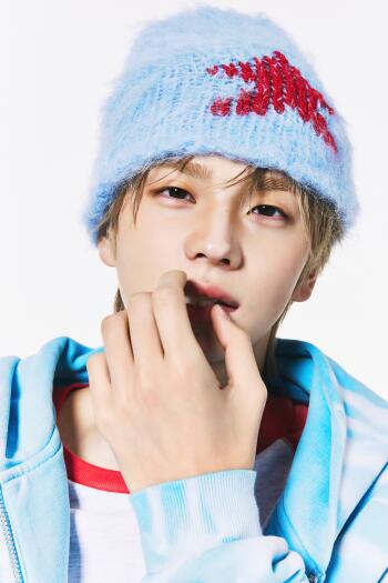 TWS Shinyu portrait in a blue knit beanie and hoodie, framed as an iPhone wallpaper.