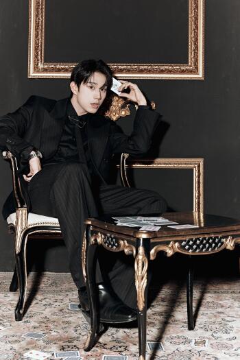 P1Harmony Secret Society Scenes phone wallpaper featuring a man in an elegant black fashion outfit seated in an ornate chair.