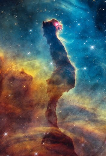 Hubble Space Telescope view of a towering pillar in the colorful Carina Nebula, a vivid space iPhone wallpaper.