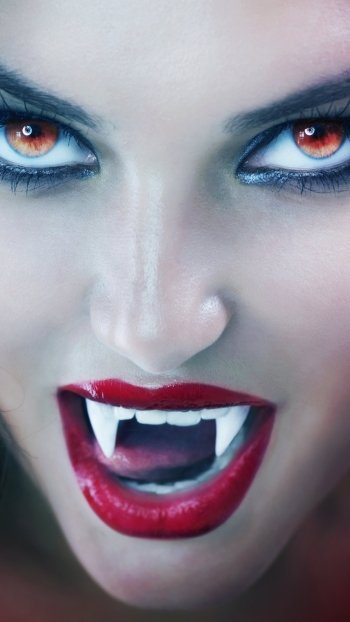 fangs red eyes brunette lipstick fantasy vampire Phone Wallpaper
