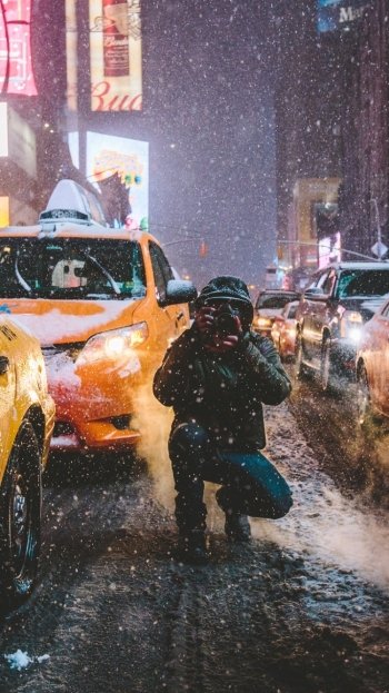 snowfall street taxi New York USA winter night car man made camera winter night Phone Wallpaper