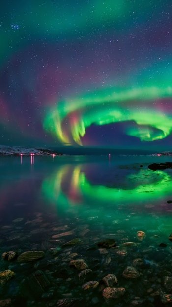  Aurora Borealis over Lake in Norway