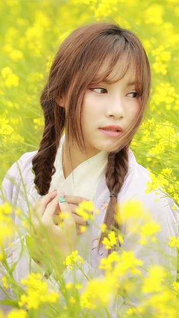 yellow flower braid brunette model woman asian Phone Wallpaper