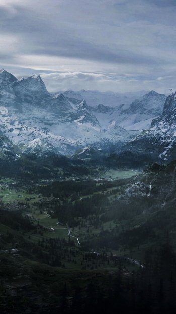 Snowy mountain landscape with a winding river, dense forest, and a dragon soaring above cliffs in a fantasy setting from The Elder Scrolls V: Skyrim, designed for phone wallpapers.