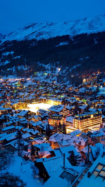 cityscape light night winter town snow Switzerland alps valley man made Zermatt winter night Phone Wallpaper